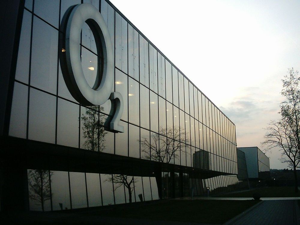 02 offices. Image of the logo on their building with the sky in the background